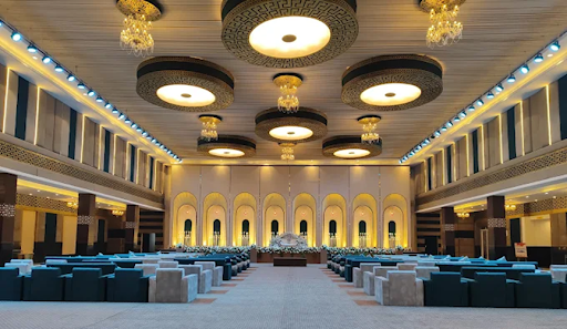 Kasturi Bagh Jaipur banquet hall interior — spacious AC hall with chandelier lighting for large wedding receptions