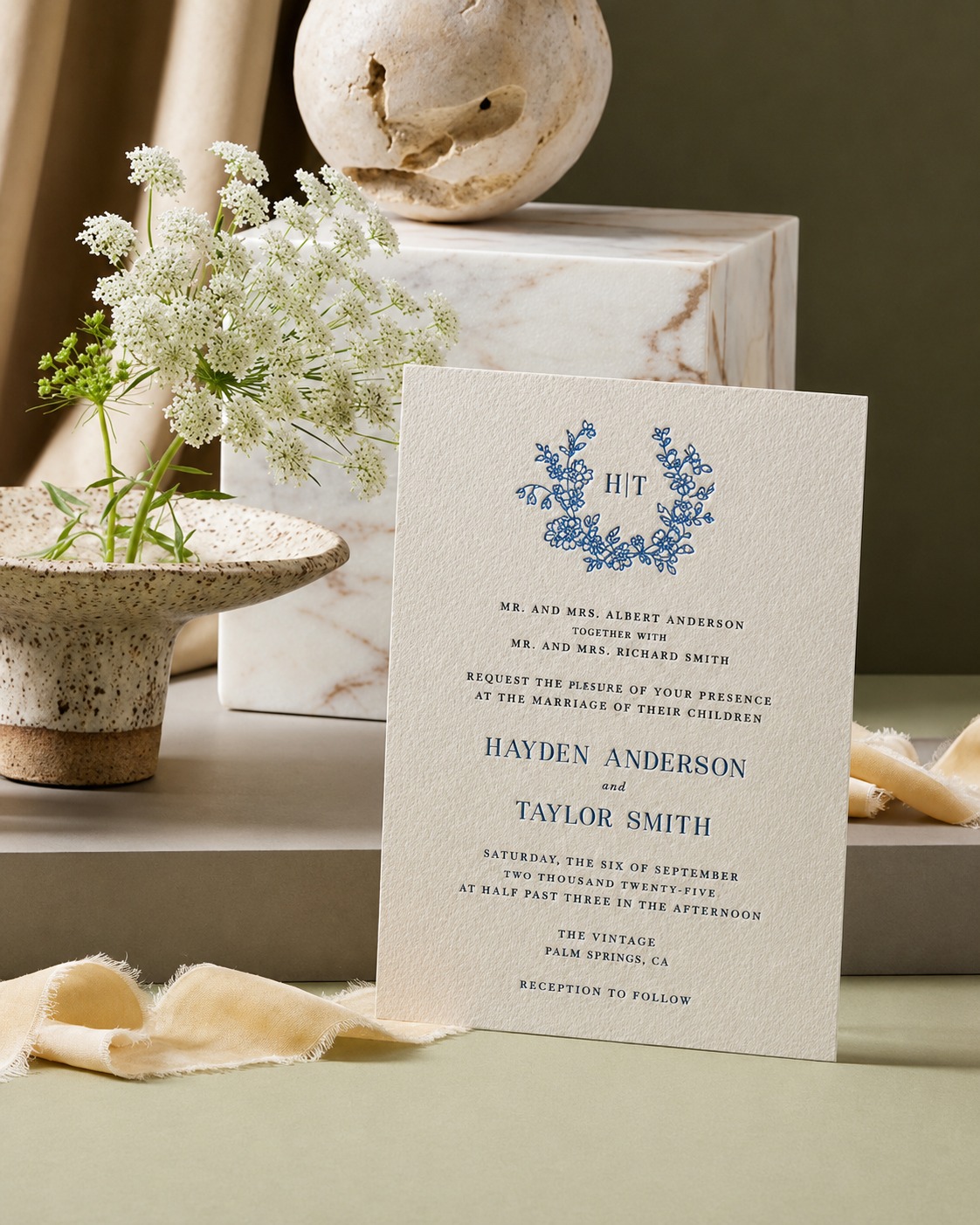 Elegant letterpress wedding invitation with floral monogram
